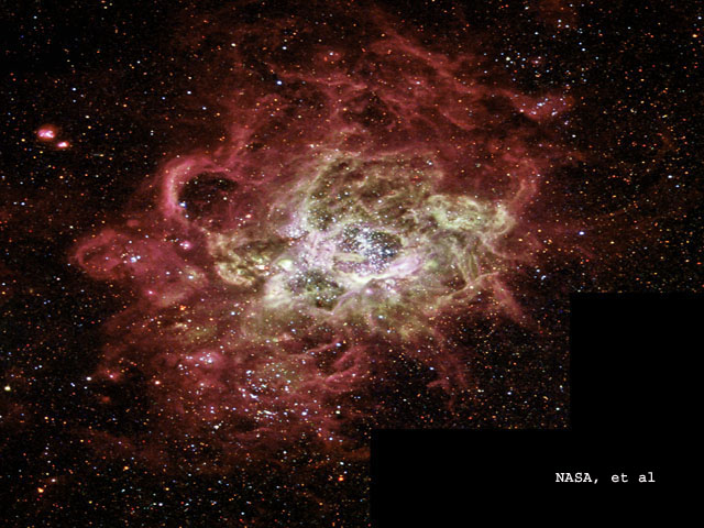 This festively colorful nebula, called NGC 604, is one of the largest known seething cauldrons of star birth seen in a nearby galaxy. NGC 604 is similar to familiar star-birth regions in our Milky Way galaxy, such as the Orion Nebula, but it is vastly larger in extent and contains many more recently formed stars. This monstrous star-birth region contains more than 200 brilliant blue stars within a cloud of glowing gases some 1,300 light-years across, nearly 100 times the size of the Orion Nebula. 