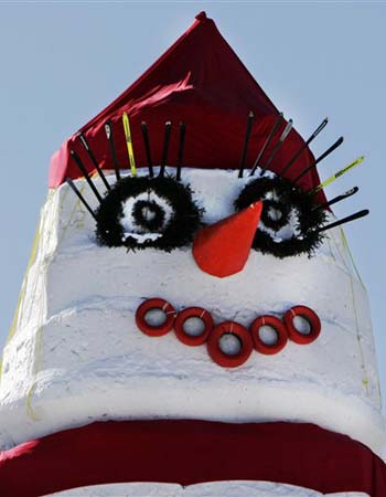 Olympia's eyelashes are made from  skis and her bright red lips are painted tires