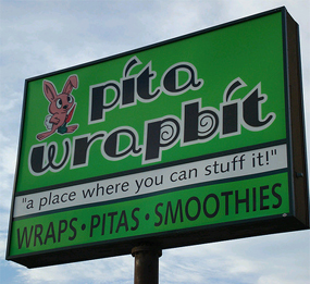 store name pun street sign - pita wrapbit "a place where you can stuff it!" Wraps Pitas Smoothies
