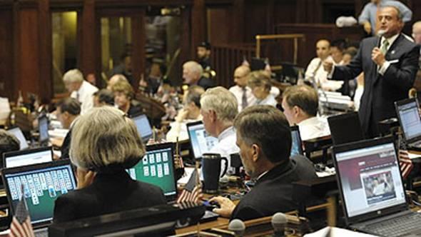  This is one of their THREE DAY WORK WEEKS that we all pay for. 

House Minority Leader Lawrence F. Cafero Jr., R-Norwalk, pictured standing, far right, speaks while colleagues Rep. Barbara Lambert, D-Milford and Rep. Jack F. Hennessy, D-Bridgeport, play solitaire Monday night as the House convened to vote on a new budget. (AP)

The guy sitting in the row in front of these two... he's on Facebook, and the guy behind Hennessy is checking out the baseball scores. 
