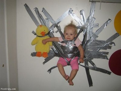 funny dad baby duct taped to wall - PicsCrazy.com