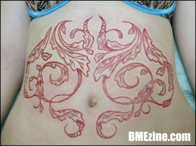 carving belly scarification - eve BMEzine.com