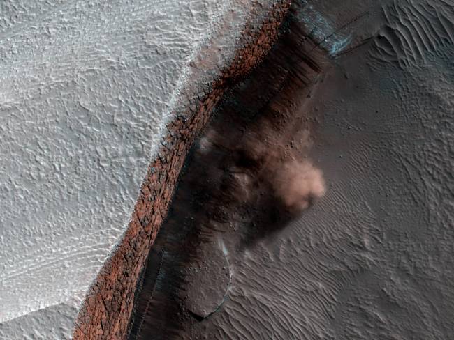 A NASA spacecraft in orbit around Mars has taken the first ever image of active avalanches near the Red Planet's north pole.