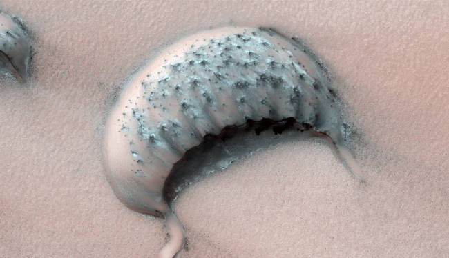A large barchan crescent-shaped dune, in a region where some dunes have been observed shrinking over several years.