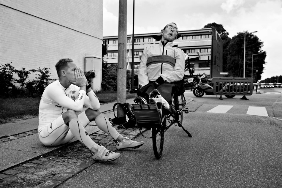 The brothers previously sought to complete a half Ironan, but had to give up 20 km into the bicycle part because the bike was breaking apart. This picture shows them waiting to get picked up by their older brother.