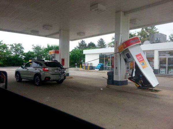 car drives away with gas pump