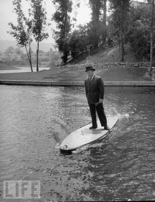 8 Motorized Surfboard, 1948 Hollywood inventor Joe Gilpin riding his motorized surfboard.