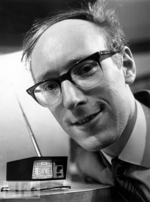  18 Mini Television, 1966 British inventor Clive Sinclair shows off his mini television. Please note the thickness of his glasses
