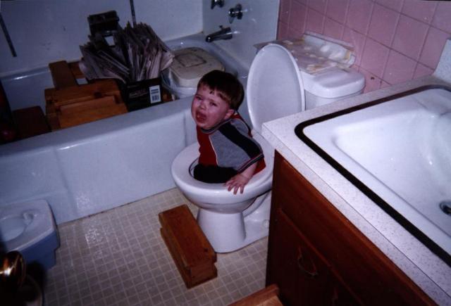 Little boy falls into the toilet then starts crying. Man up you little punk 