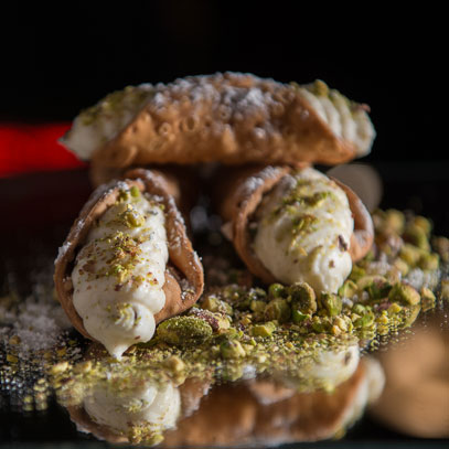 Cannoli.  This pastry filled with a sweetened ricotta cheese cream returns to the fair in full or mini sizes.