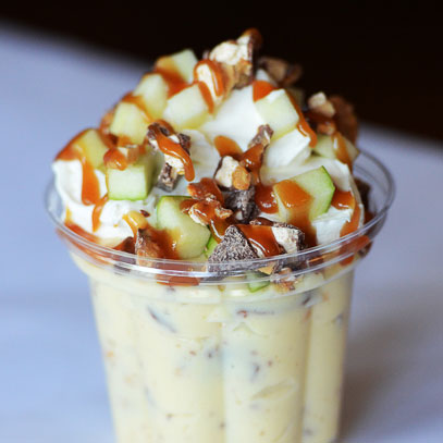 Grandma Deb’s
Snicker Bar Salad.  Chopped Snickers® bars and Granny Smith apples tossed in vanilla pudding with whipped cream and drizzled with caramel sauce