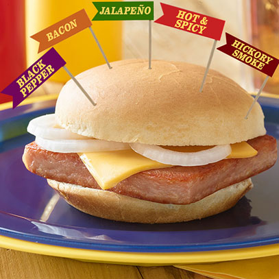 SPAM® Burgers in 5 New Flavors.  A grilled SPAM® burger with cheese and onions, in your choice of five flavors: Jalapeño, Hot & Spicy, Bacon, Hickory Smoke and Black Pepper