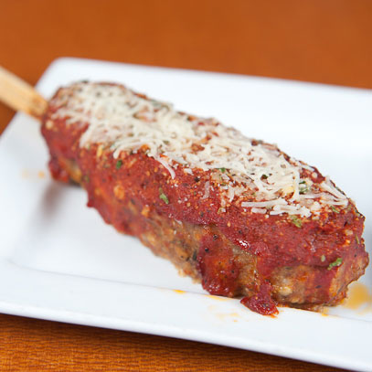 Stuffed Italian Meatloaf On-a-Stick.  Italian meatloaf stuffed with Mozzarella and pepperoni, topped with marinara sauce and a Parmesan herb blend and served on-a-stick