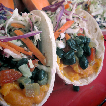 Sweet Potato Taco.  Mashed sweet potatoes, black beans, sautéed onions and vinegar coleslaw wrapped in a flour tortilla