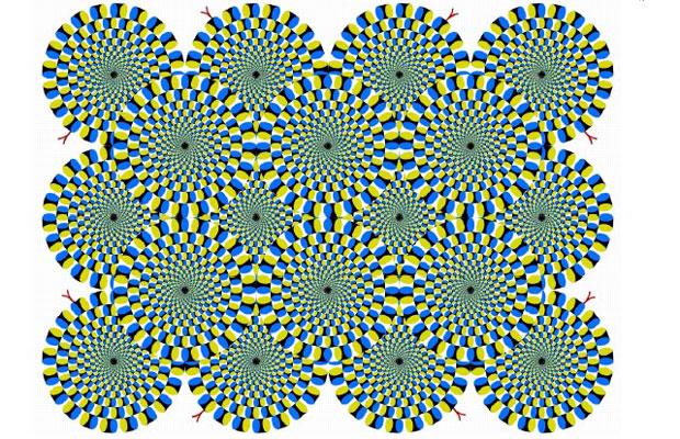 If you focus on the picture, all the wheels start to spin (in both directions). However, if you then concentrate on a single wheel, that wheel will stop whilst the others keep turning. 