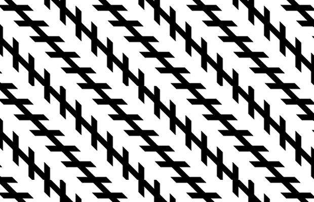 The long black lines are in fact parallel to each other. The illusion is created by the shorter lines being at an angle to the longer lines, this creates the impression that one end of the longer lines is nearer to us