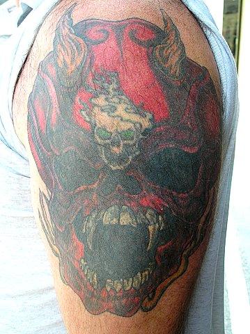 Cover up i had done. The skull with the green eyes was first. I add some crap around it. Look like shit, so I had this Big Ass Demon Skull put over it.