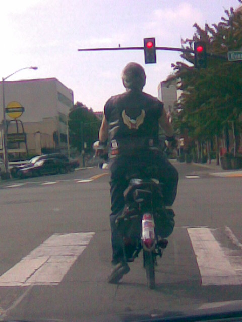 A biker dude I saw riding a goofy bicycle. 