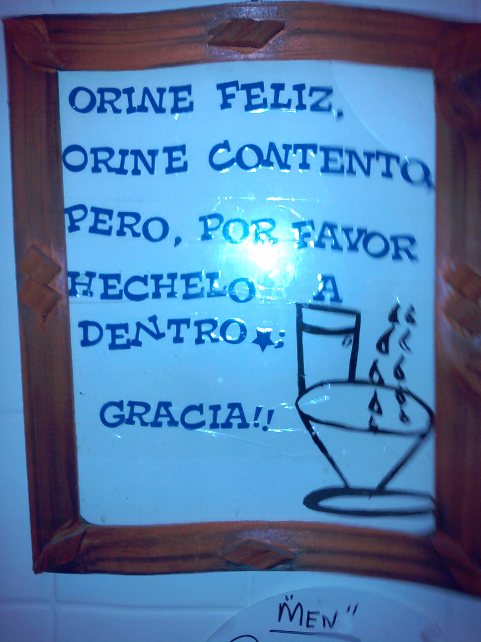 Un cuadro en un restauran dominicano , 
Translation: its a sign at a Dominican restaurant that reads , pee happy , pee content , but please it the toilet.
it sound better in spanish 