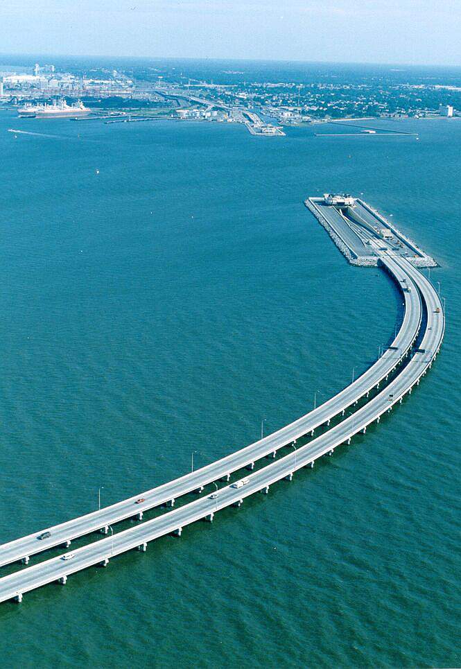 This bridge and tunnel goes under water to allow movement of ships. In order for ships to pass, this bridge is half under the water. You drive down in the water and then come out on the other side. Truly a marvelous piece of engineering! This bridge is between Sweden and Denmark. Picture taken from the side of Sweden.