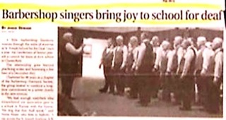 Headline - Barbershop singers bring joy to school for deaf