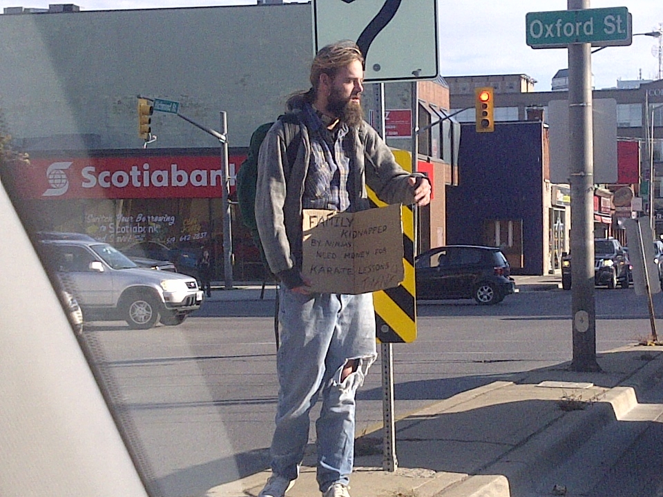 Hilarious sign a bum was using in London, Ontario.  Only in Canada will you see crap like this.