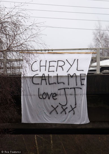 A fan has hung this banner on the A3 road near her and Ashley Cole's house, in the hopes, we reckon, that she'll see it and, erm, pick up the phone. Talk about wishful thinking. But still, it's a nice gesture, isn't it?