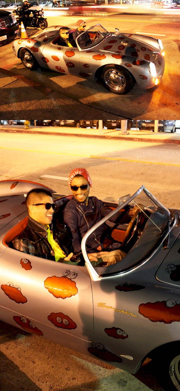 While filming his latest music video with Paris-based singer Uffie, Pharrell Williams was spotted last night with Chad Hugo from N.E.R.D. on the streets of Los Angeles driving around in a Porsche 550 Spyder with custom graphics done by the artist KAWS.