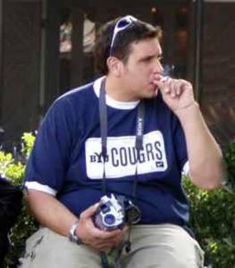 BYU license plate tee from bookstore. $25, Stylish sunglasses $49, Below the knee length cargo shorts, $55
Gold CTR ring in the language of my mission $150, Sony camcorder to tape the big game $399
Enjoying a smoke at half time--PRICELESS!!