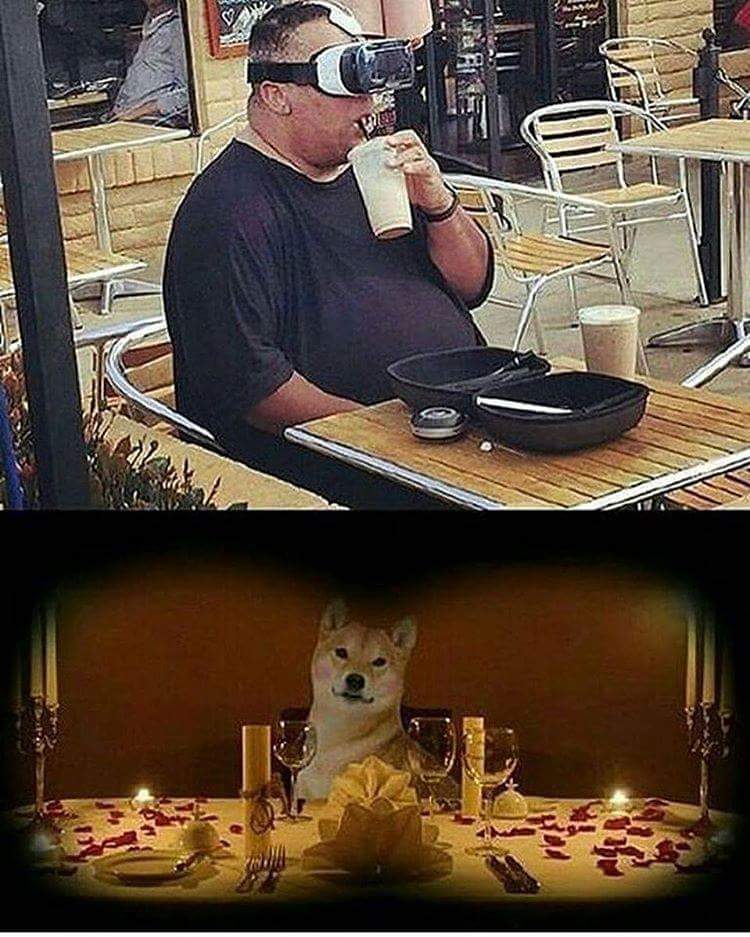 Man drinking milkshake while wearing VR glasses and having dinner with doggo
