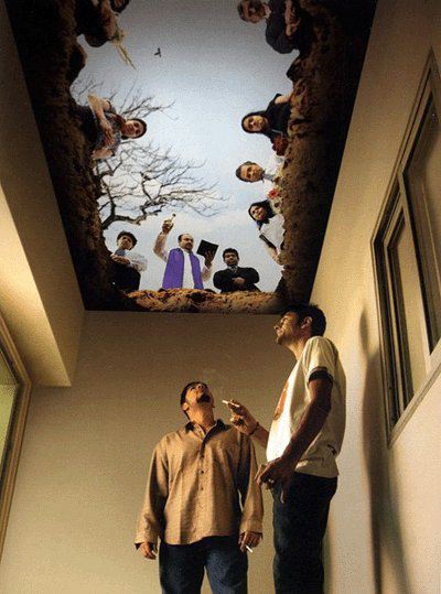 A cool picture on the ceiling of a smoker's lounge