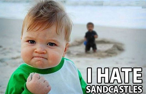 Damn sandcastles. This cute baby ain't a real big fan of them. Make sure he doesn't catch you on a beach. 