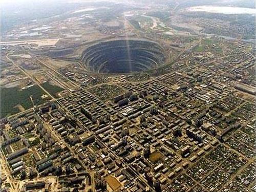 Mirny Diamond Mine , Serbia This one is an absolute beast and holds the title of largest open diamond mine in the world. At 525 meters deep, with a top diameter of 1200 meters, there's even a no-fly zone above the hole due to a few helicopters having been sucked in.