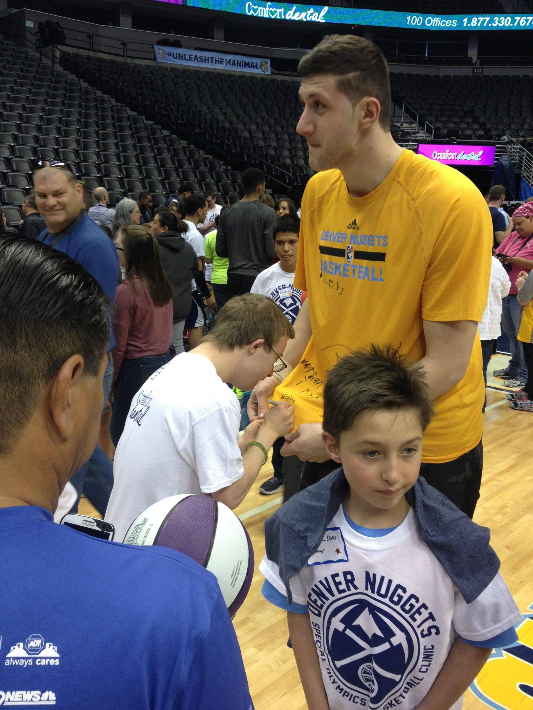 Denver Nuggets Center Jusuf Nurkic asking Special Olympics athlete for his autograph