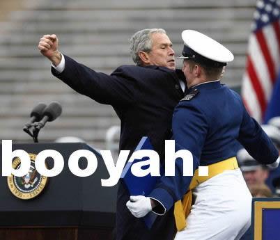 president George Bush chest bumping some guy in uniform