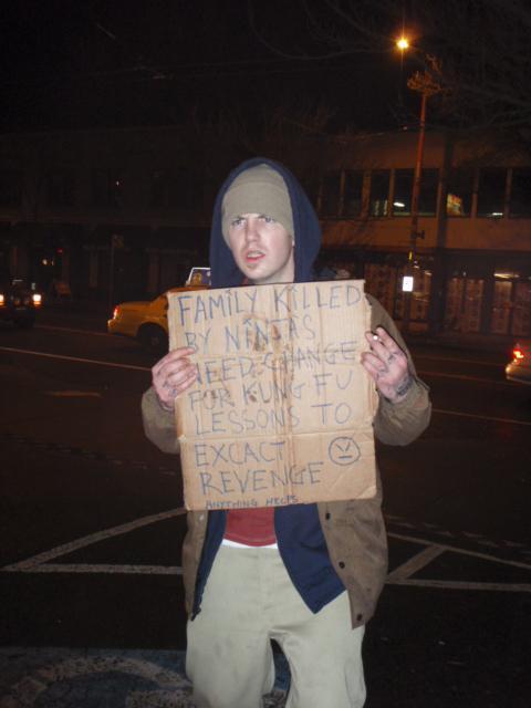 Random homeless guy in Seattle sparing for change.