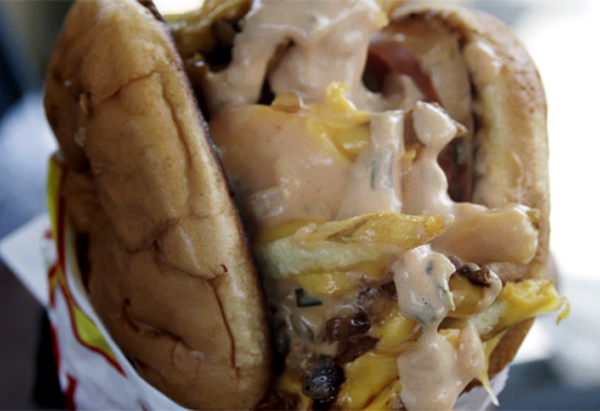 The fabled Monkey Style...In-N-Out burger with french fries, cheese, grilled onions and spread.
