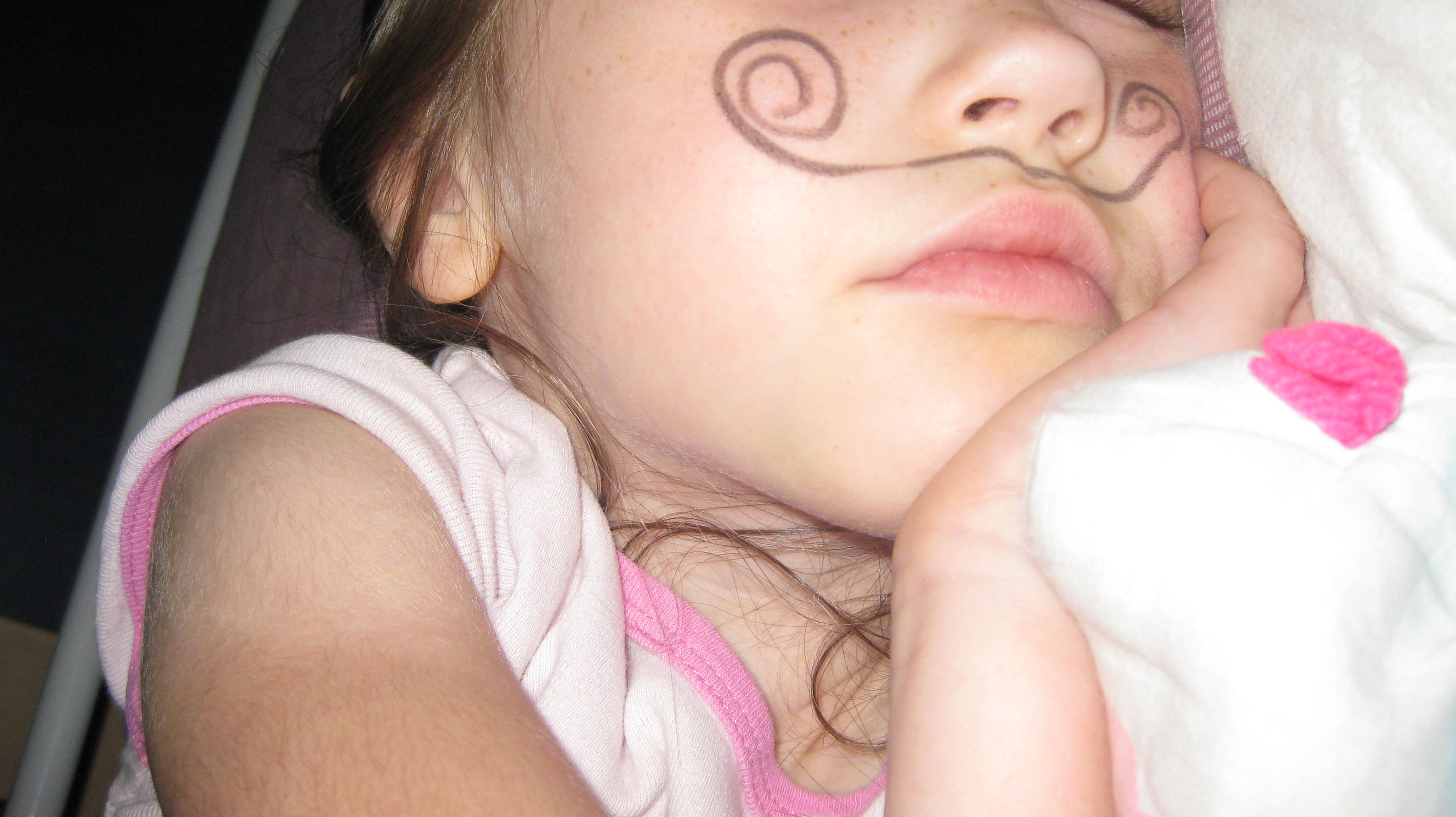 Using eye liner, draw a mustache on them while sleeping.