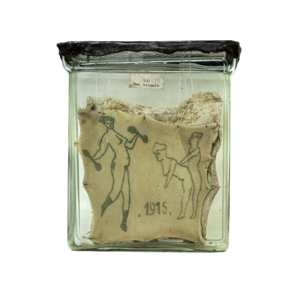 Cataloged from the body art archive at the department of forensic medicine at Jagiellonian University in Krakow, Poland, the 60 extractions are carefully preserved in formaldehyde, sheltered within a glass jar to reveal the designs.