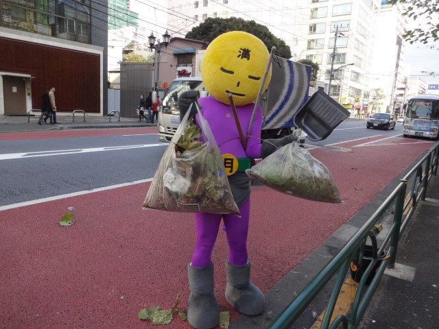 Anonymous Man In A Superhero Costume Is Fighting Grime In Tokyo