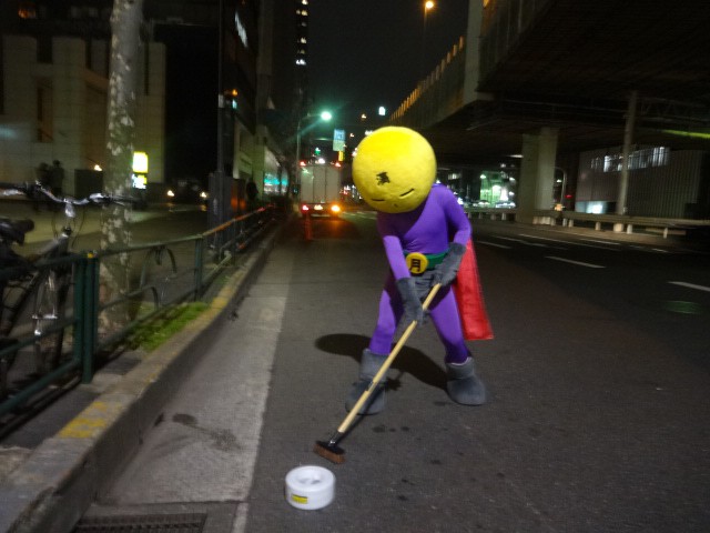 Anonymous Man In A Superhero Costume Is Fighting Grime In Tokyo