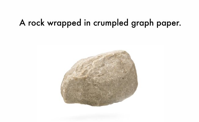 rock - A rock wrapped in crumpled graph paper.