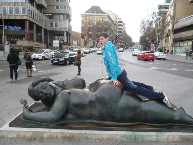 People Having Fun Posing With Statues