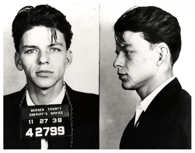 A 23-year-old Frank Sinatra has his mug shots taken after he was arrested for adultery and seduction, a crime at the time. [1938]