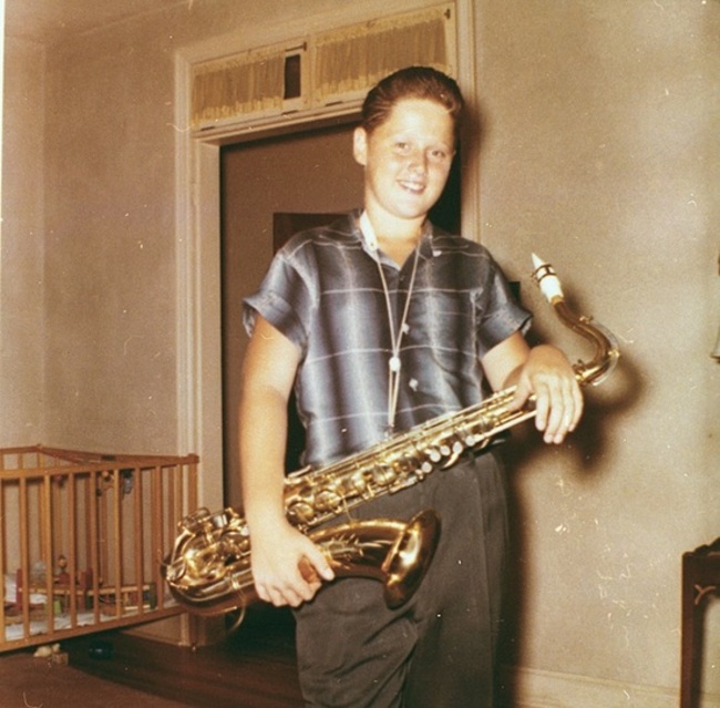 A young BIll Clinton with his saxophone. [c. 1960]-Clinton was in the chorus of his elementary school and played the tenor saxophone, winning first chair in the state band's saxophone section. He briefly considered dedicating his life to music.