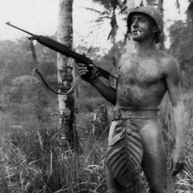 A US Marine, somewhere in the Pacific Islands, poses for the camera. [c. 1941 – 1945]