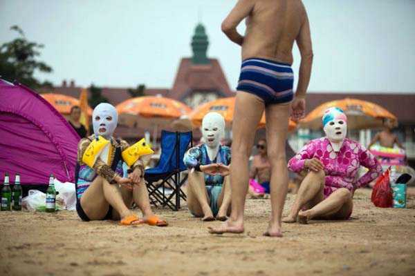 Beachgoers In China Have A New Sun Protection Strategy