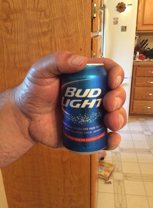 A tiny beer can or a massive hand? Who fucking cares.