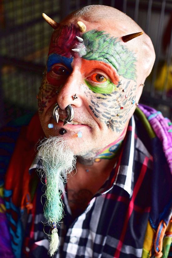 Ted Richards, 56, is obsessed by pets Ellie, Teaka, Timneh, Jake and Bubi and has his face tattooed with colourful feathers.