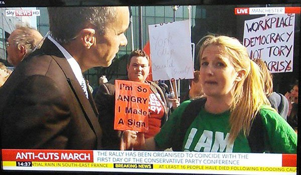 photo caption - Sky News How Live Manchester Workplace Democracy Vot Tory Krisy im So Angry I Made A Siga The Rally Has Been Organised To Coincide With The AntiCuts March First Day Of The Conservative Party Conference Stial Rain In SouthEast France Breaki